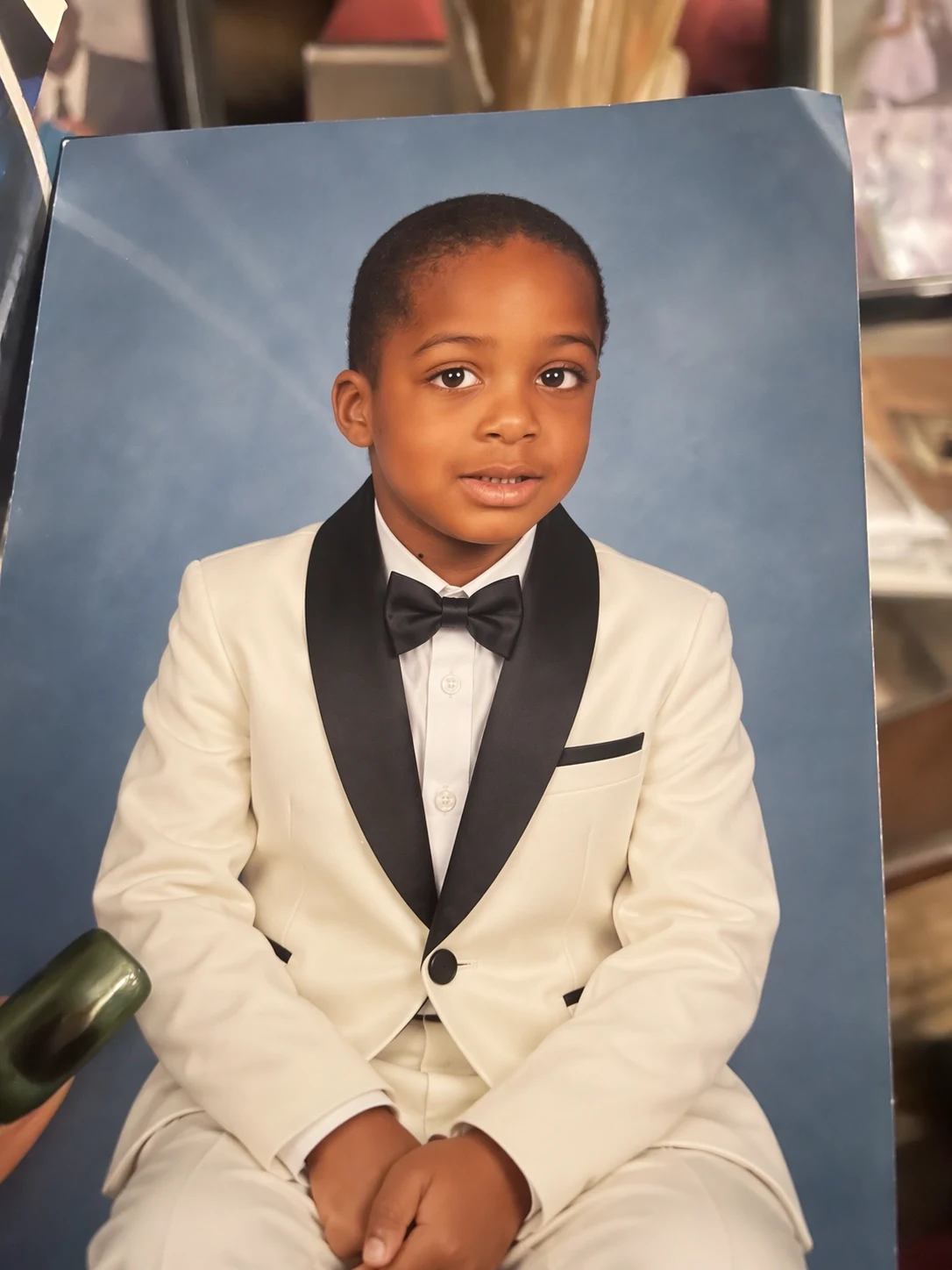Published GPT Image 2.5 family edit preserving the child while changing the outfit to a white tuxedo