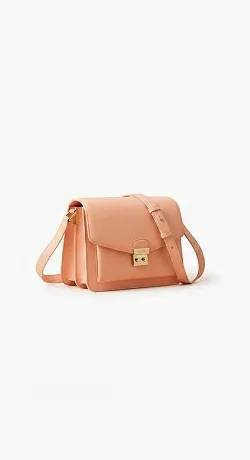 Plain catalog photo of a peach leather shoulder bag before a Nano Banana 2.1 edit